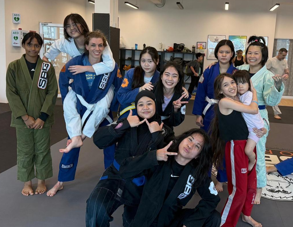 Women's BJJ class at SBG Borneo working on a guard pass drill together